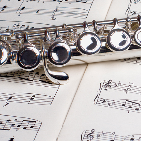 photo of a flute on sheet music