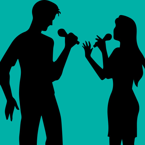 silhouettes of two people singing