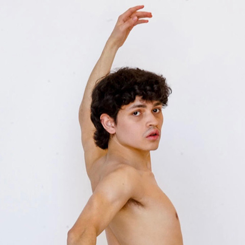 Adrian Ruiz posing with arms up and down