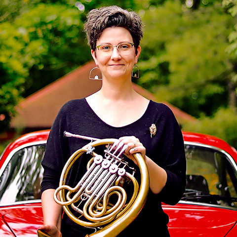 Denise Tryon holding french horn