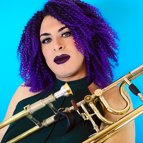 Sasha Romero holding trombone