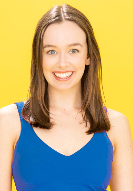 Headshot of Brooklin Toli with a yellow background 