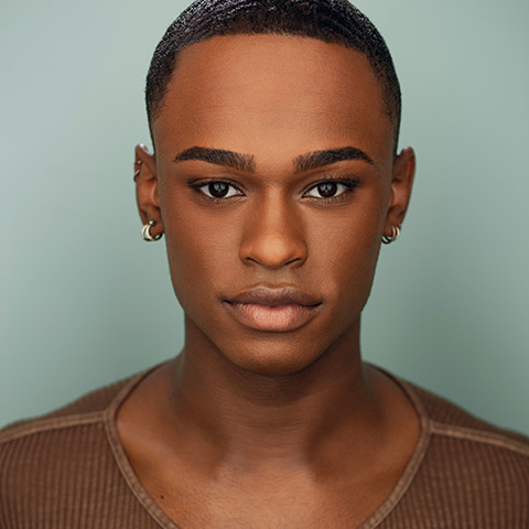 Jalen Bunch headshot: standing in front of a light teal wall