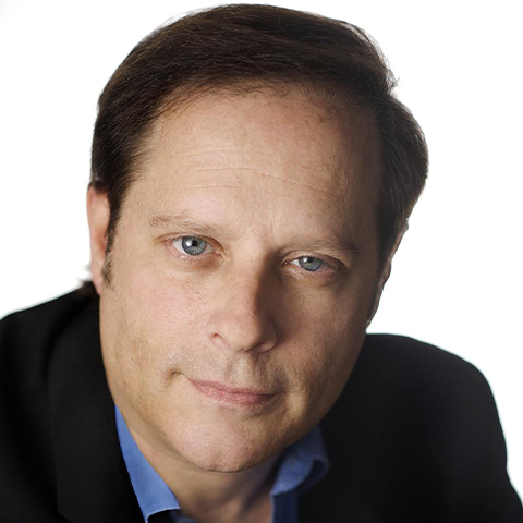 Michael Lewin headshot; wearing a suit with a blue shirt.