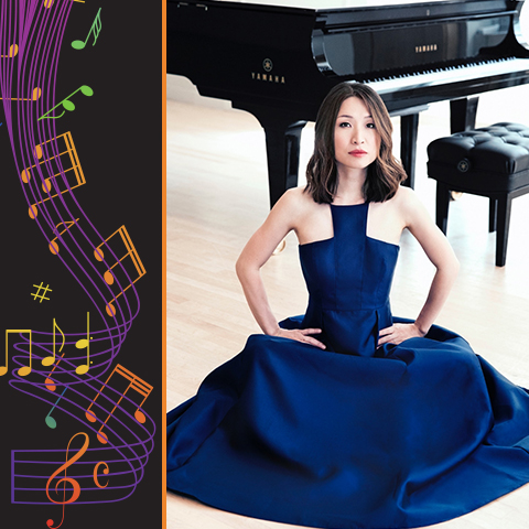 woman in a blue dress sits in front of a piano