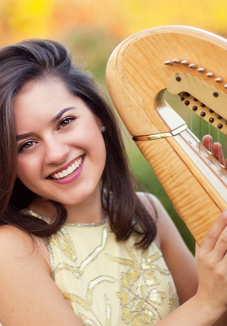 Krysten Keches headshot with harp