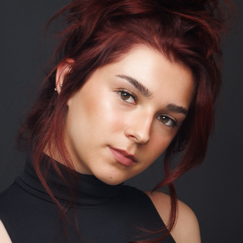 Maddie Bannwarth headshot: wearing a black turtleneck tank top