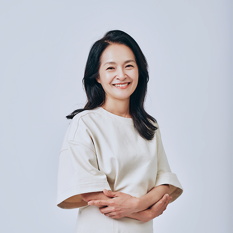 Eun Young Lee smiling in a white outfit