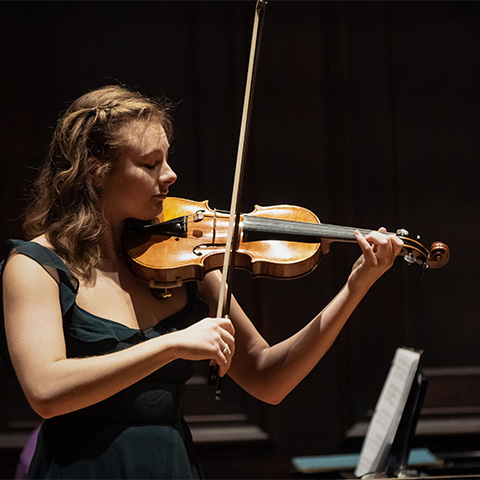 a student plays a violin 