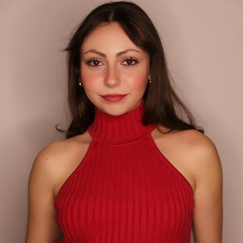 Carina Brunstein headshot: wearing red tank top