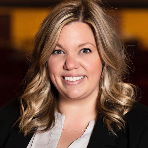 Rebecca Donald hedashot: smiling in a jacket and white button up