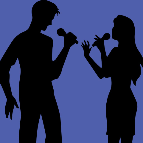 two people sing with microphones against a purple background 