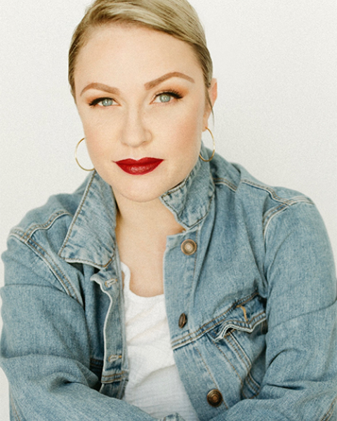 Headshot of Lindsey Klein smiling with an off-white background