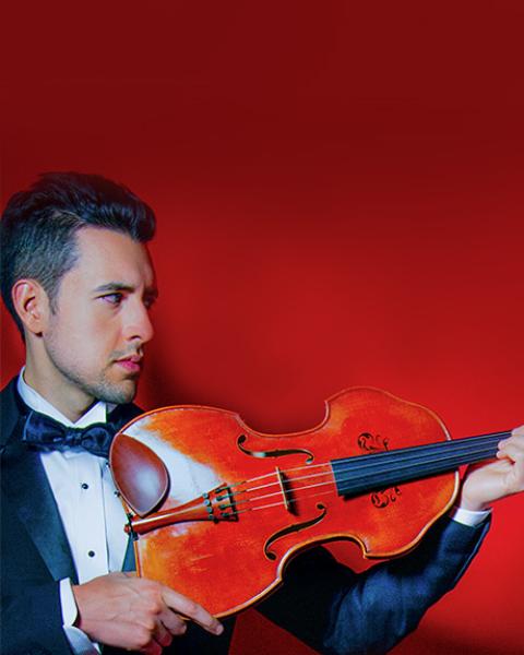 Photo of Paul Laraia holding viola with a red background