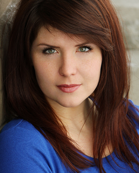 Rosie Ward headshot—wearing a blue long sleeve shirt.