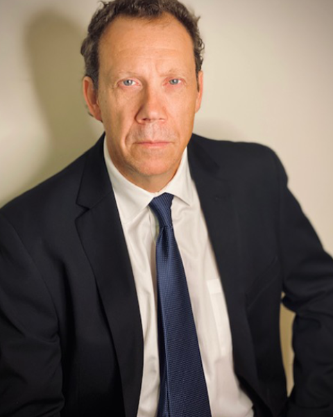 Marcus Giamatti headshot, wearing a suit and tie