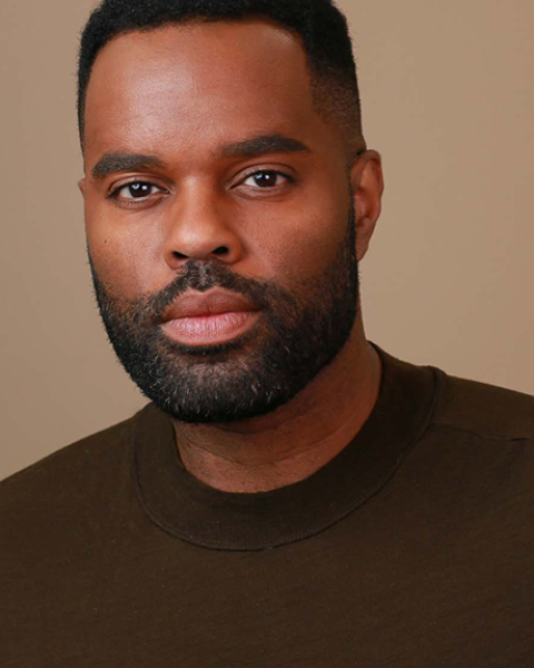 De'Lon Grant headshot: wearing brown shirt