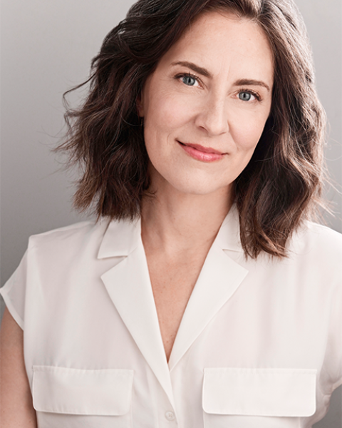 Zipporah Peddle headshot: smiling and wearing a white top