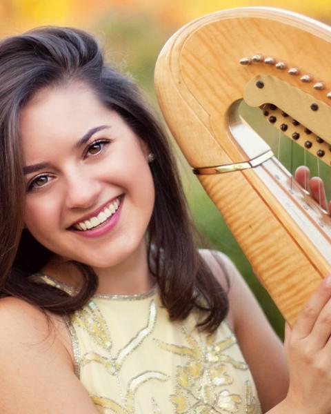Krysten Keches headshot with harp