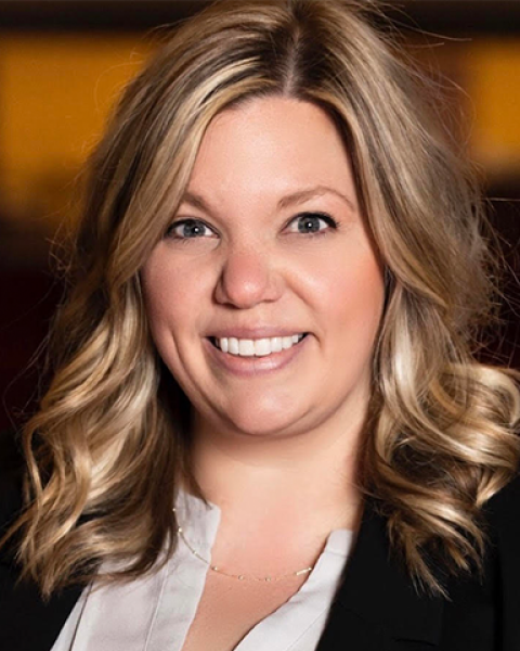 Rebecca Donald hedashot: smiling in a jacket and white button up