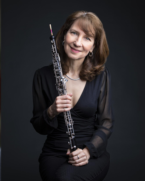 Nancy Dimock holding an oboe