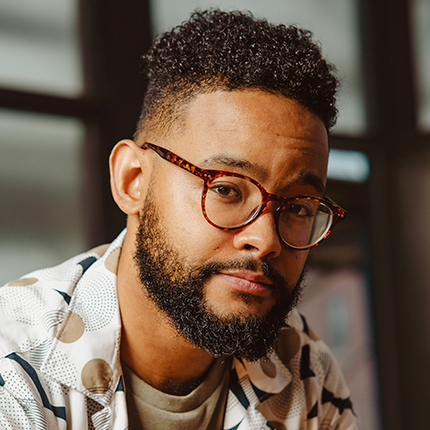 Miguel Landestoy smiling.