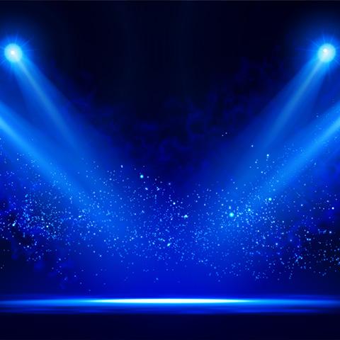 Blue spotlights on stage