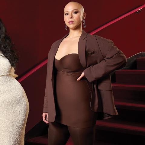 Alums Gabby Reyes and Melanie Bacaling in front of a red staircase