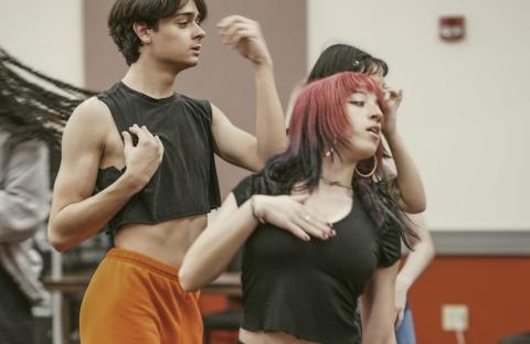 Two commercial dance students dancing while looking to the right