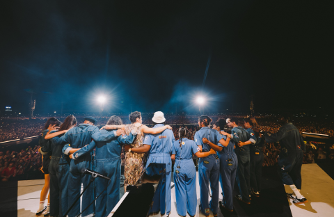 Trumpeter Laura Bibbs (fifth from right) joins Harry Styles and the rest of his band, as they take a bow on stage at the RFC Arena in Reggio Emilia, Italy. 
