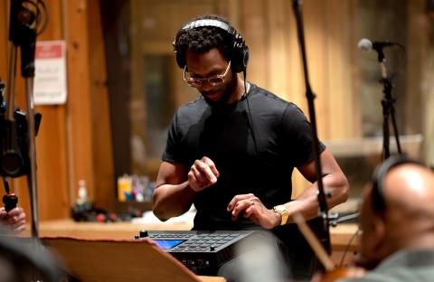 Anthony Barfield wearing headphones in a music studio