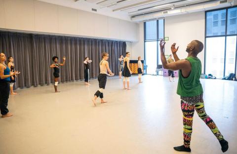 Kurt Douglas (right) leads student dancers in a rehearsal for José Limón’s The Unsung.