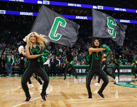 Isabelle Richards, left, dances with her teammates during a Celtics game.  