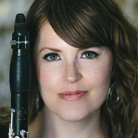 Rane Moore headshot holding clarinet