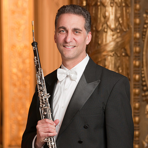 Rob Sheena headshot holding English Horn