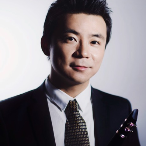 YaoGuang Zhai headshot holding clarinet