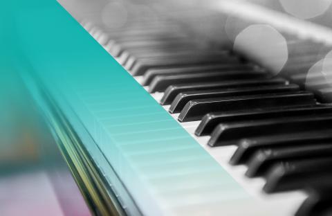 Black and white photo of a piano with a blue hue on the left