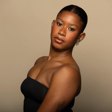 Cheyenne Carrington-Greene headshot, wearing a black bandeau