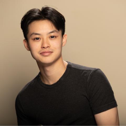 Derek Lee headshot posing wearing a black tshirt