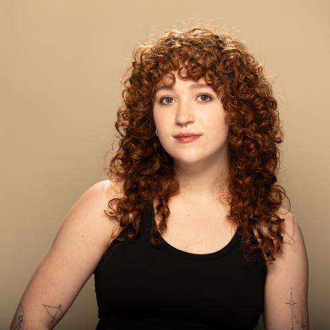 Eliana LaBreche headshot: posing in a black tank top