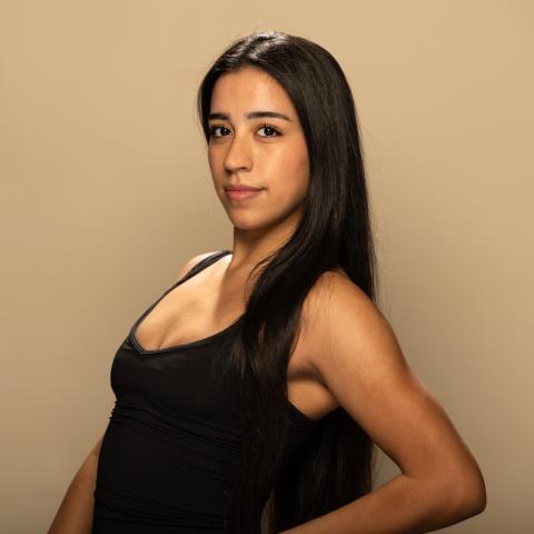 Halley Campo headshot: posing in a black tank top