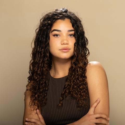 Kylah Walker headshot: posing in black top