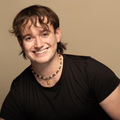 Michael Braun headshot: smiling in black t-shirt