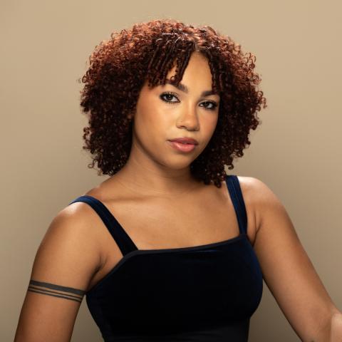 Samarra Rodriguez headshot: posing in a black tank top