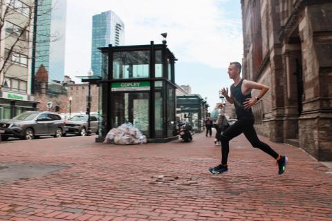 Xander Dawson running in front of Copley Square T stop