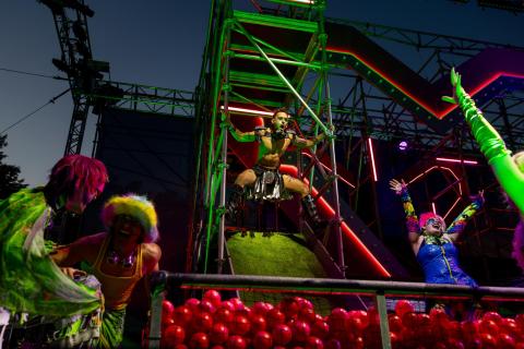 Nick Cearley (as Puck) slides into a ball pit