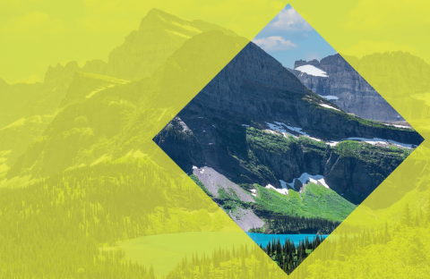 Image of a mountain with a yellow-green film over the image, excluding a diamond shaped opening 