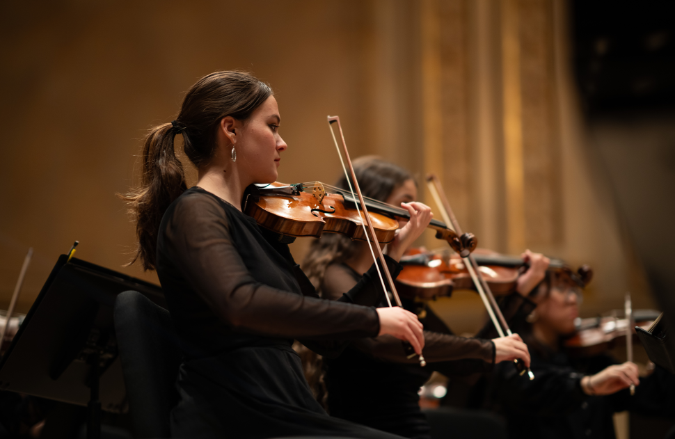 violin players onstage at Carnegie Hall